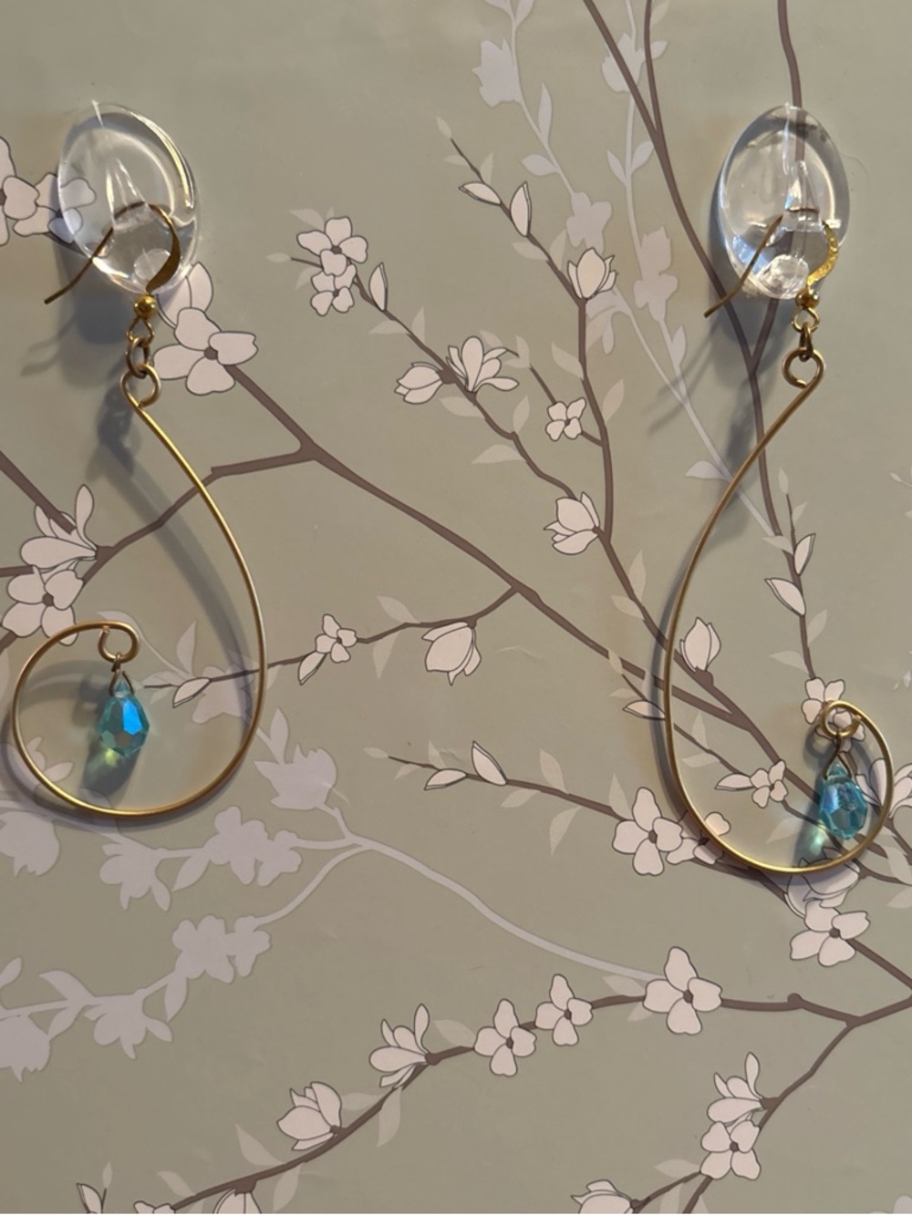 Gold Teardrop Earrings with Blue Crystal Dangles